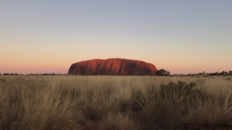 how to plan a gap year to Australia to look out over the red rock in the centre of Australia.